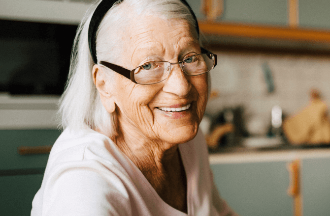 woman in glasses smiling