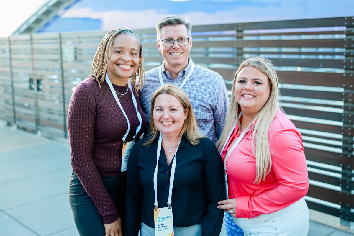 geron employees smiling at outdoor event