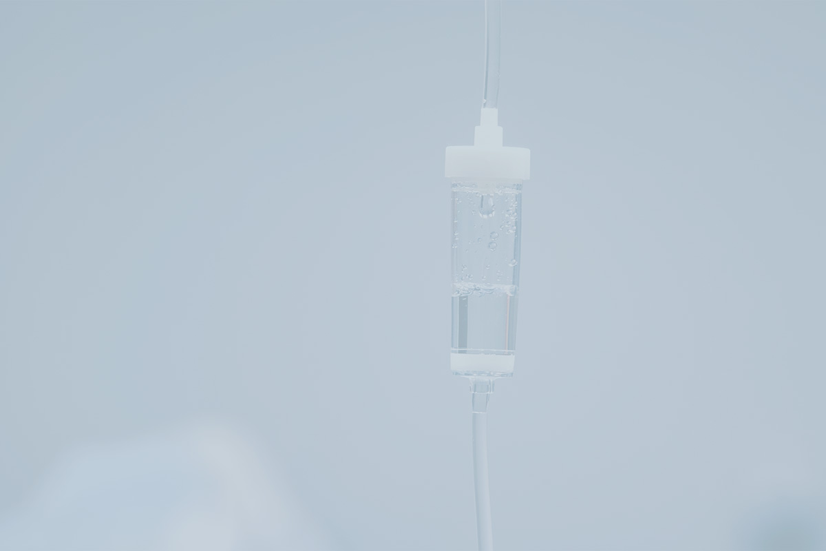 Intravenous IV drip infusion bag hanging in a clinical hospital setting
